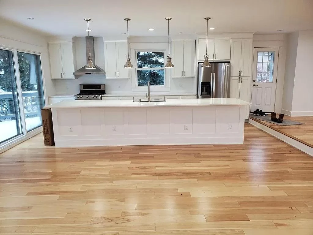 After Kitchen Renovation with White Shaker Cabinets & Quartz Island - Kentwood MI - Grand Rapids Contracting
