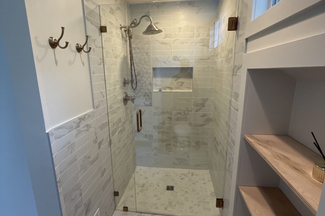 Walk in shower with built in shelving after completed Grand Rapids bathroom remodel